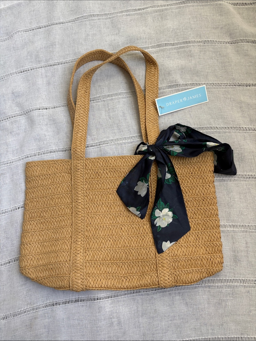 Draper James woven straw vacation tote bag.